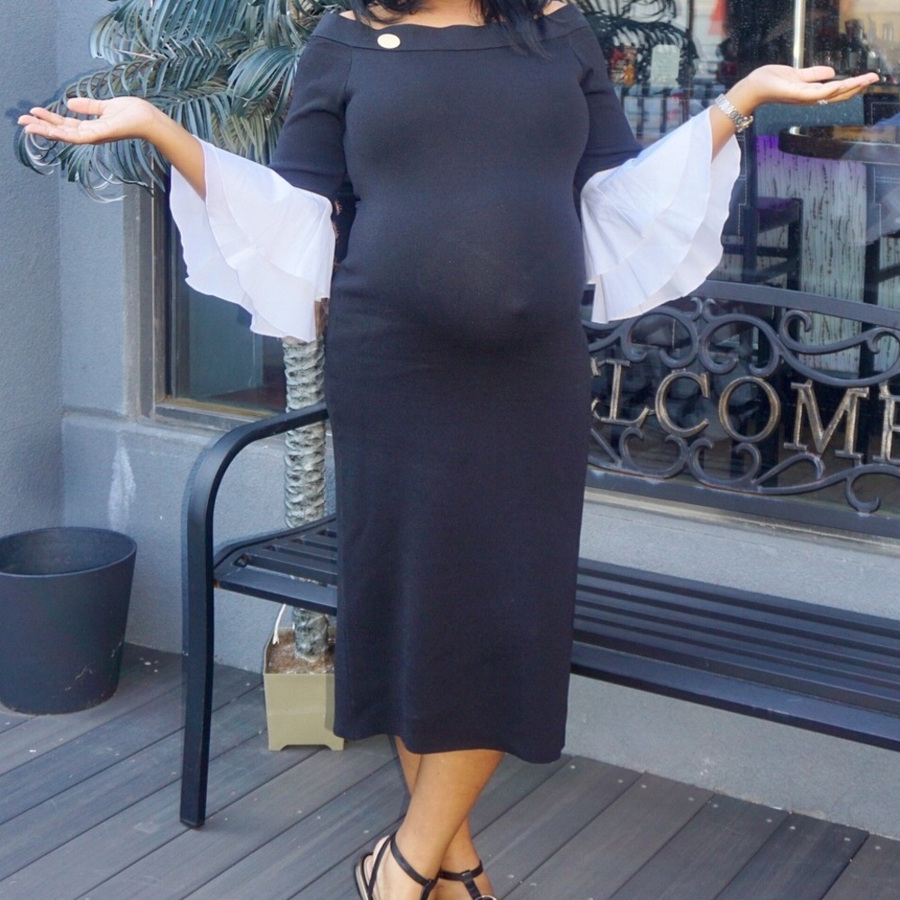 Beautiful sweater dress with ruffle sleeves.